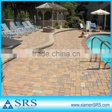 sandstone swimming pool surround and matched paving