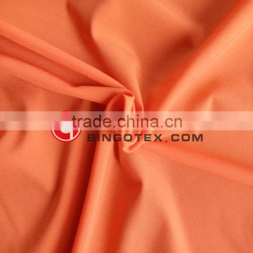 Nylon 4 way stretch orange fabric for legging Garment