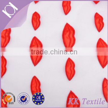 100% Poly organza fabric with red satin lips embroidery