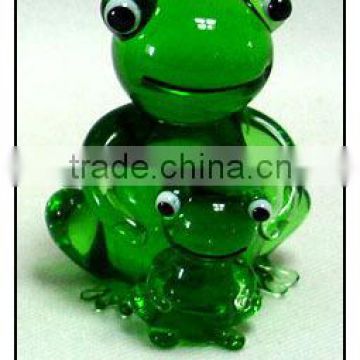 clear glass green big frog holding a small frog