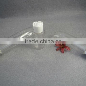 trasparent cosmetic lotion bottle with rose cap