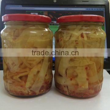 Pickled bamboo shoot slices in glass jars