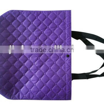 Embossed quilted handle bag with non woven laminated
