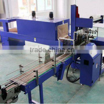 Automatic shrink wrapping machine