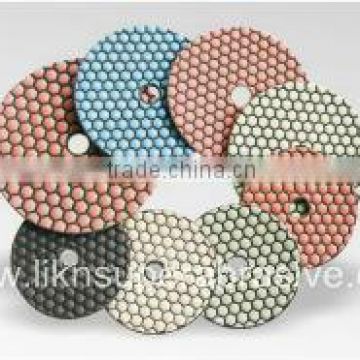 Dry polishing pads with QRS
