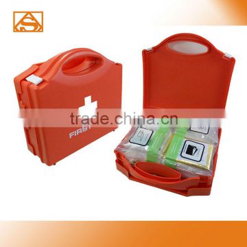 Red plastic first aid kit box din13169
