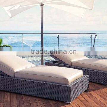 Luxury rattan beach chair with sun parasol