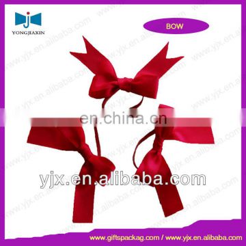 red small ribbon bow with elastic cord