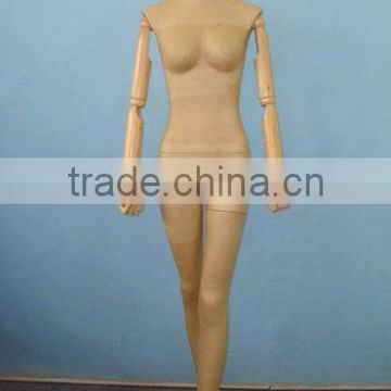 female mannequin with wooden arms
