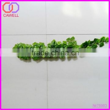 artificial green leaves outside wall covering