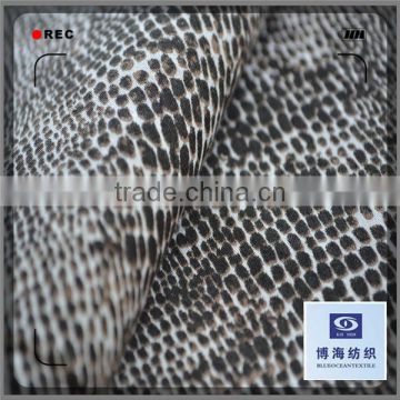 printed satin fabric with the pattern of snake skin