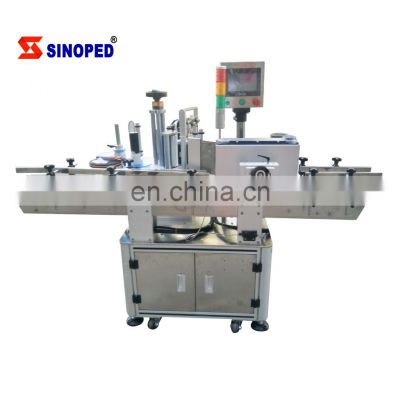 Automated round bottle labeling machine for multi height diameter bottles