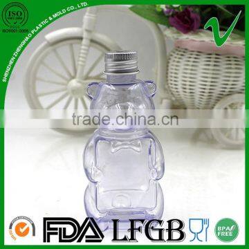 custom clear fancy bear shaped plastic bottle with crown cap