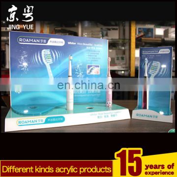 Factory custom L shape pmma plexiglass acrylic rechargeable electric sonic toothbrush display stand