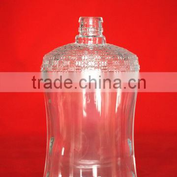 large glass bottle with crown top
