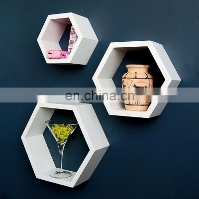 Decorative shelves on hexagonal wooden wall rack