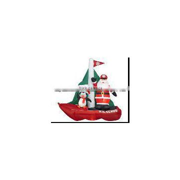 Inflatable Santa on boat with Penguin