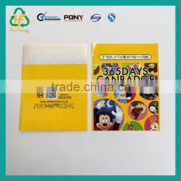 Small laminated plastic packaging pouch