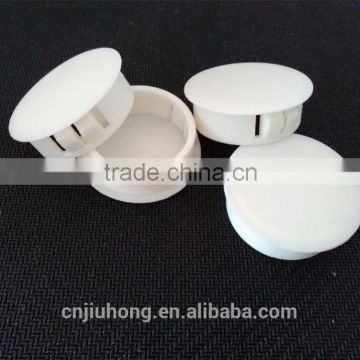 white plastic hole plugs