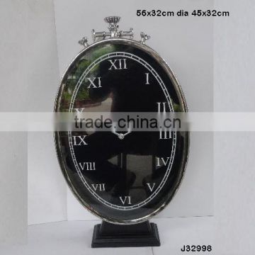 vertical oval shape steel Metal table clock on base in mirror polish other finishes available