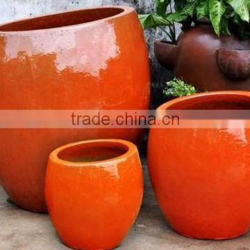 Set of 3 Orange ceramic pots,