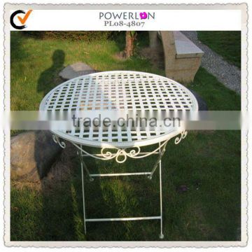Antique white hammered metal table