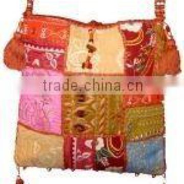 Embraced with exotic enigma in this hand embroidered with vintage sari fabric and mirror work women shoulder bag