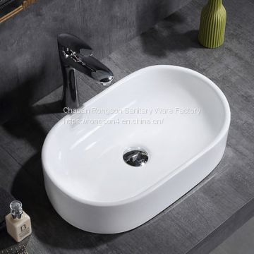 Chaozhou good design ceramic white deep washing dinner oval basin sink with no hole for sale
