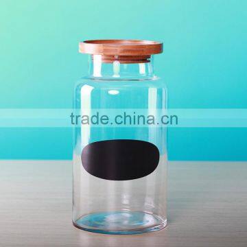 glass storage jar with black sticker and wooden cover