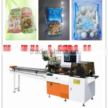 Edible mushrooms with tray reciprocating wrapping machine