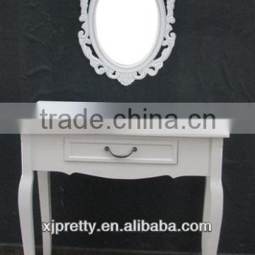 white carven wooden mirror
