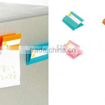 colourful small plastic clip used to clip paper magnet