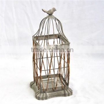 Antique old gray metal and rope birdcage