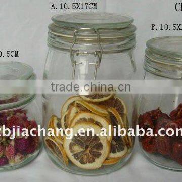 Clear glass food storage bottle with metal clip