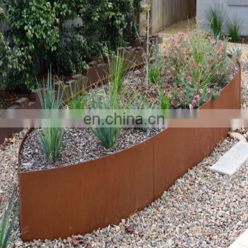 Rusty Steel Garden Edgings With Spikes Inserted  into the Soil