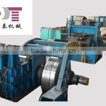 hydraulic coiling machine with hold down arms device