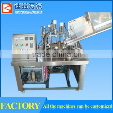 Plastic tube filling and sealing machine