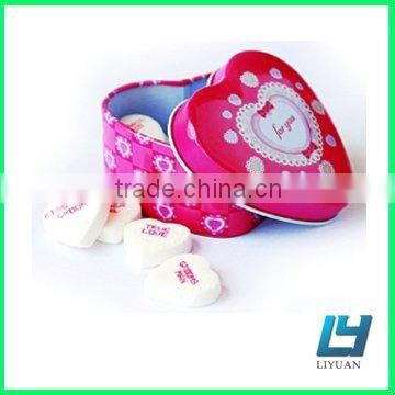 Red heart shaped candy tin box