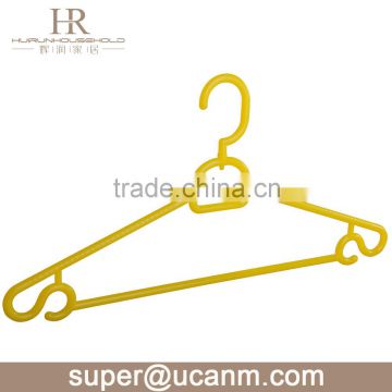 yellow color plastic clothing hanger