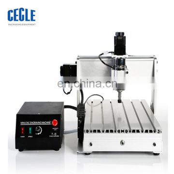 storm mini desktop cnc3040 3 axis/4 axis pvc pipe cnc engraving machine with low price