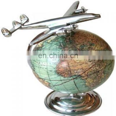 world globe with airplane model