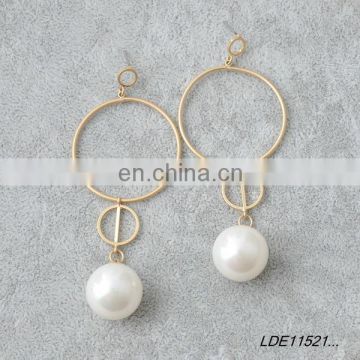 Worn gold circle earring
