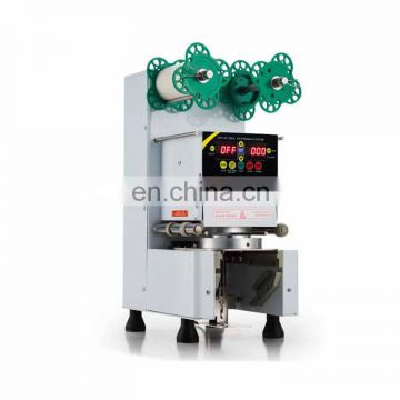 factory price automatic plastic butter cups sealing machines/Sodas Cola Sprite cup sealer