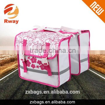 pink and white double rear pannier bag
