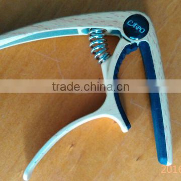 Newly Created Guitar Capo in Wooden Color With Screwdriver Design and Teeth Shaped Silicone Directly From Factory