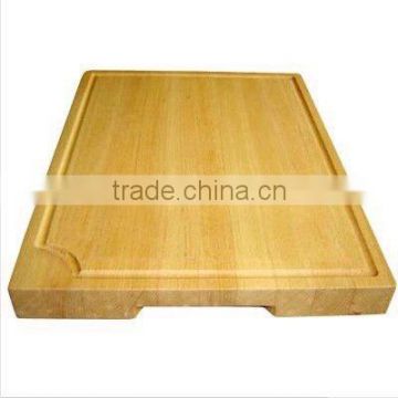 Wood cutting board with groove