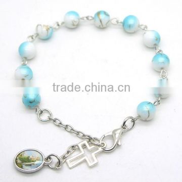glass beads bracelet with small religious medals ,small bracelet with a cross