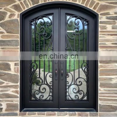 house entry big double glass arched eyebrow top black cast iron frame unique scrolls heavy duty front design wrought iron door