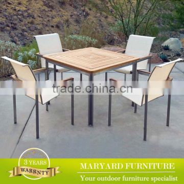 Stainless steel table legs with teak table top