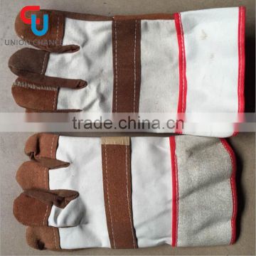 Industrial leather working glove with safety cuff